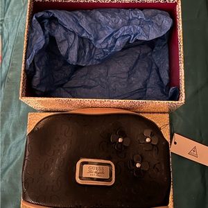 Small guess makeup bag black and brown